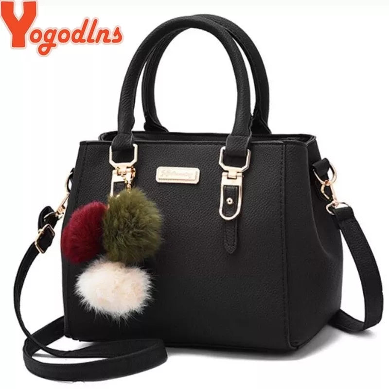 High Quality Embossed handbag with hairball Pendant